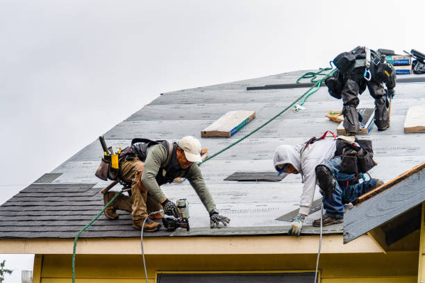 Professional Roofing technician working in Floral Park, NY